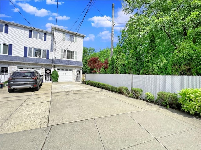 5 Greaves Ave, Staten Island, NY 10308 - view of side of property featuring concrete driveway and an attached garage