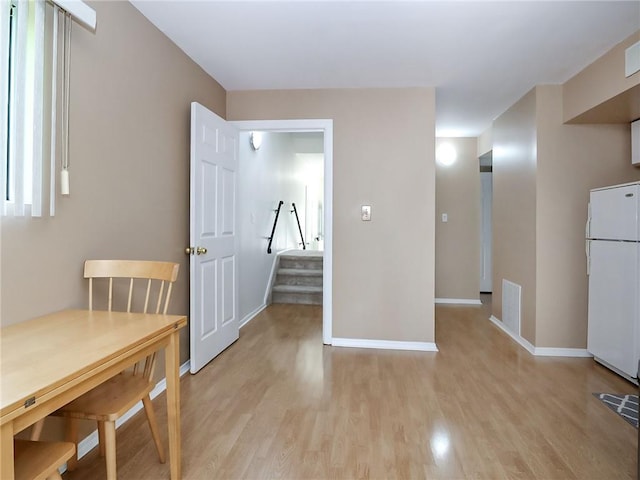 5 Greaves Ave, Staten Island, NY 10308 - unfurnished dining area featuring light wood-style flooring and stairs