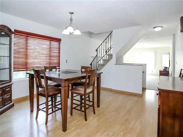 5 Greaves Ave, Staten Island, NY 10308 - dining area featuring light wood-style floors, stairway, and a chandelier
