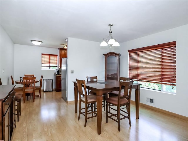 5 Greaves Ave, Staten Island, NY 10308 - dining area with light wood-style flooring and a chandelier