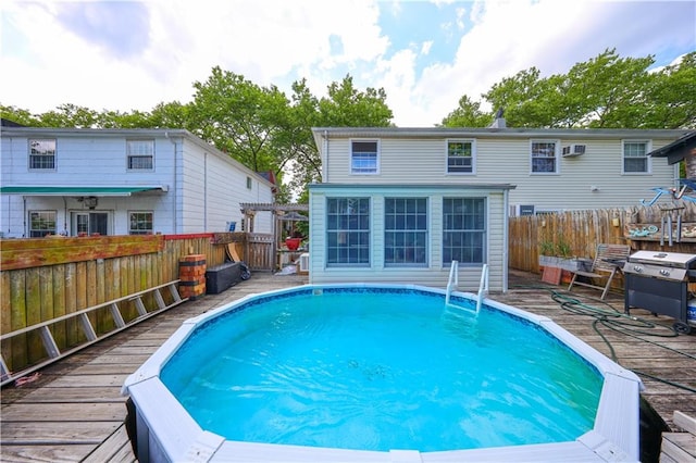 15 Allison Pl, Staten Island, NY 10306 - view of pool with a wooden deck, a grill, an AC wall unit, and a pergola