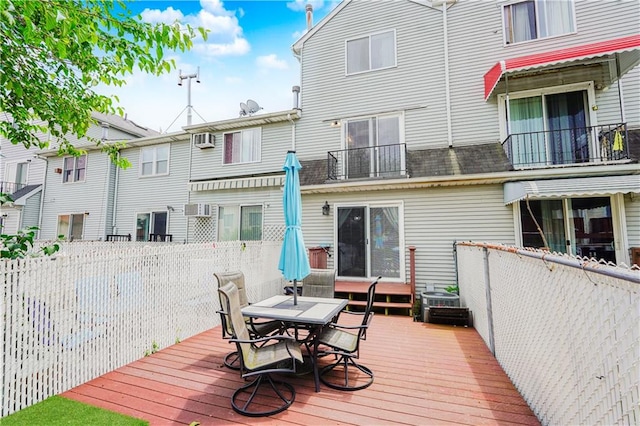 172 Rosedale Ave, Staten Island, NY 10312 - wooden deck with outdoor dining space and a wall mounted AC