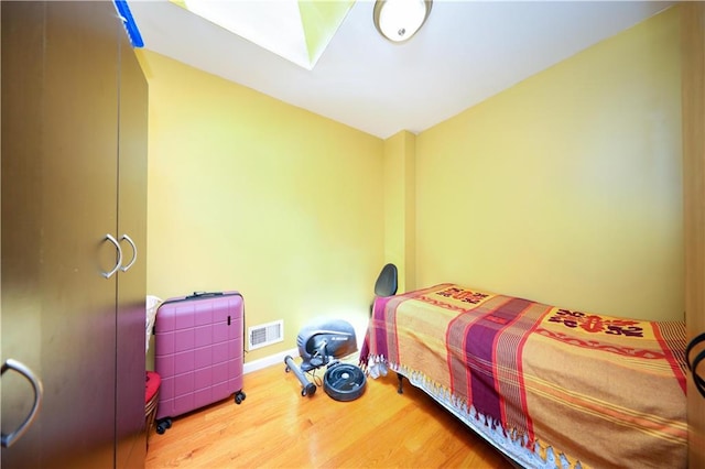300A Andros Ave, Staten Island, NY 10303 - bedroom with wood finished floors and a skylight