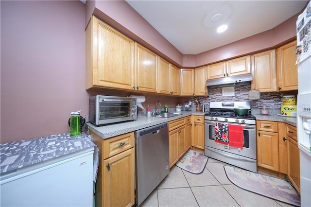 300A Andros Ave, Staten Island, NY 10303 - kitchen with stainless steel appliances, under cabinet range hood, backsplash, and light countertops