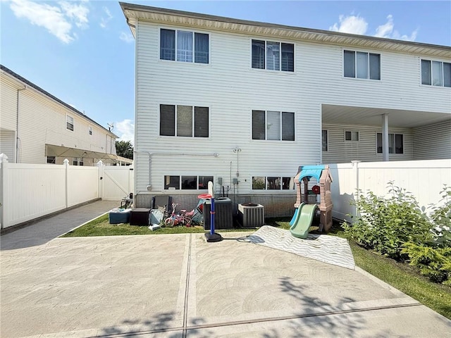 54 Poplar Ave, Staten Island, NY 10309 - rear view of house with a patio, a playground, and a gate