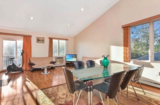 4817 Bedford Ave Unit 3A, Brooklyn, NY 11235 - dining space with lofted ceiling, wood finished floors, a baseboard radiator, and recessed lighting