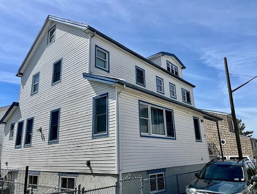6 Opal Ct, Brooklyn, NY 11229 - view of side of property with a fenced front yard