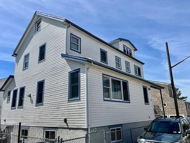 6 Opal Ct, Brooklyn, NY 11229 - view of side of property with a fenced front yard