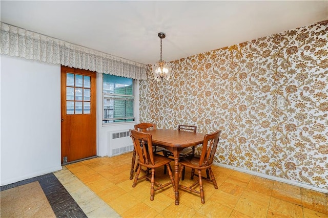 1935 Shore Pkwy Unit 8E, Brooklyn, NY 11214 - dining space with wallpapered walls, radiator, light flooring, and a chandelier