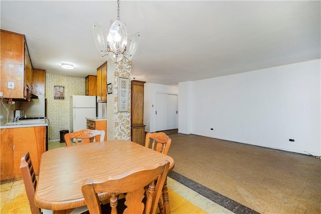 1935 Shore Pkwy Unit 8E, Brooklyn, NY 11214 - dining area with a chandelier and wallpapered walls