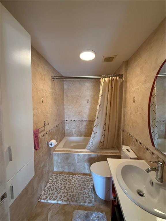 2964 Brighton 6th St Unit 4B, Brooklyn, NY 11235 - bathroom featuring tile walls, tiled shower / bath combo, and vanity