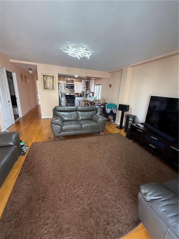 2964 Brighton 6th St Unit 4B, Brooklyn, NY 11235 - living room with wood finished floors