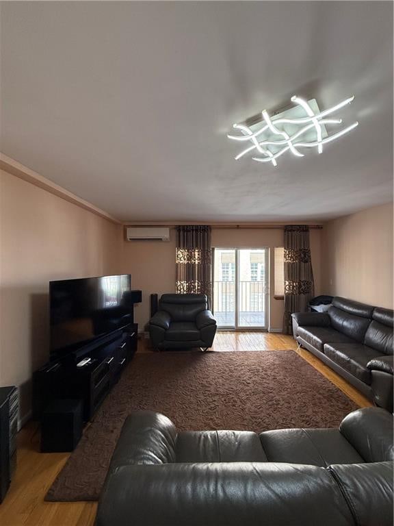 2964 Brighton 6th St Unit 4B, Brooklyn, NY 11235 - living room featuring a wall unit AC and light wood-type flooring