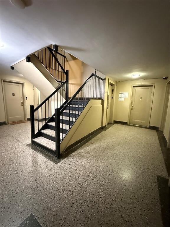 2821 Kings Hwy Unit 4M, Brooklyn, NY 11229 - staircase featuring speckle patterned floor