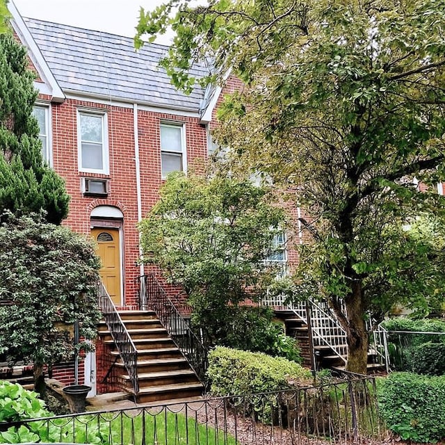 2067 E 28th St, Brooklyn, NY 11229 - view of front facade with brick siding and stairway