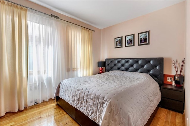 1650 68th St, Brooklyn, NY 11204 - bedroom with multiple windows and wood finished floors