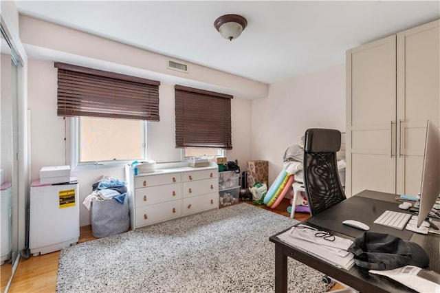 1650 68th St, Brooklyn, NY 11204 - home office with plenty of natural light and light wood-style floors