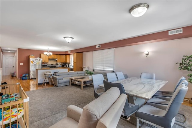 1650 68th St, Brooklyn, NY 11204 - living room with a chandelier and light wood finished floors