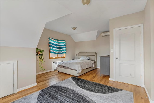 1650 68th St, Brooklyn, NY 11204 - bedroom with radiator heating unit, wood finished floors, an AC wall unit, and vaulted ceiling