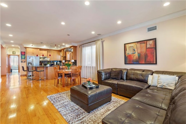 1650 68th St, Brooklyn, NY 11204 - living area with ornamental molding, light wood-style floors, and recessed lighting