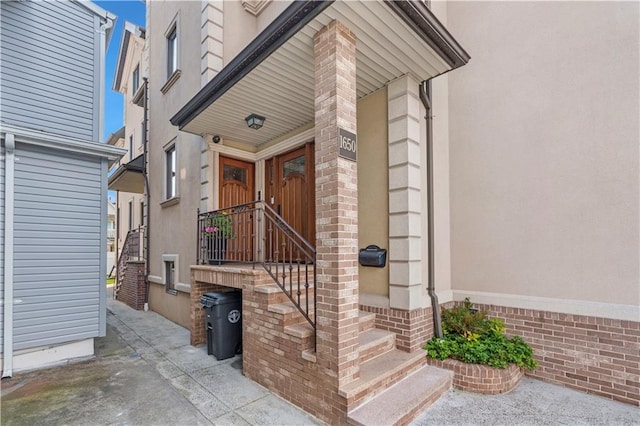 1650 68th St, Brooklyn, NY 11204 - view of exterior entry featuring stucco siding