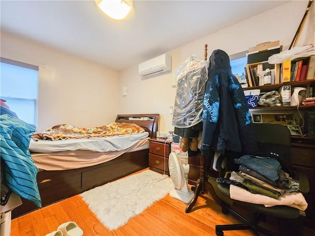 8219 7th Ave, Brooklyn, NY 11228 - bedroom with a wall unit AC and wood finished floors