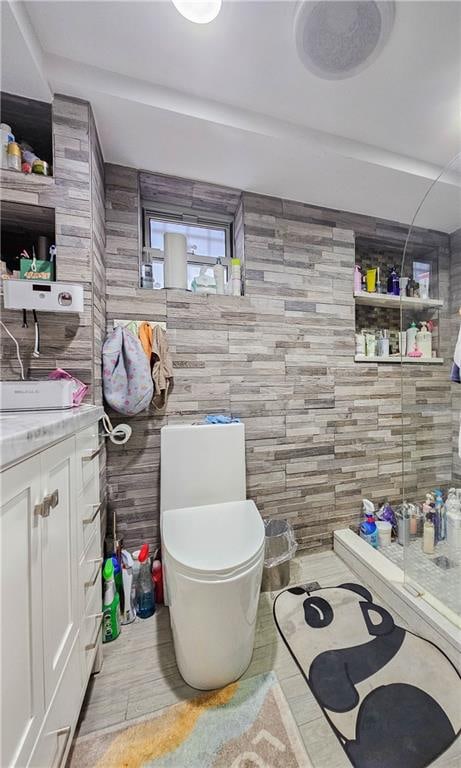8219 7th Ave, Brooklyn, NY 11228 - bathroom featuring toilet and wooden walls