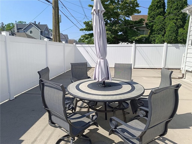 268 Nelson Ave, Staten Island, NY 10308 - fenced backyard with outdoor dining area and a patio