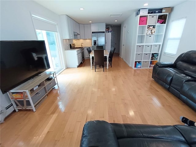 268 Nelson Ave, Staten Island, NY 10308 - living room featuring light wood-type flooring and recessed lighting