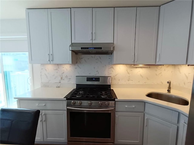 268 Nelson Ave, Staten Island, NY 10308 - kitchen with stainless steel range with gas cooktop, exhaust hood, light countertops, and backsplash