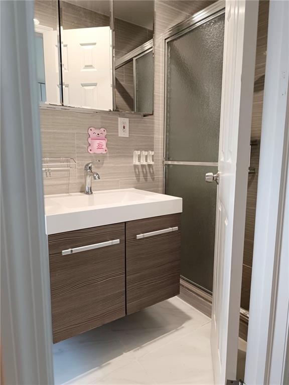 268 Nelson Ave, Staten Island, NY 10308 - bathroom featuring vanity and an enclosed shower