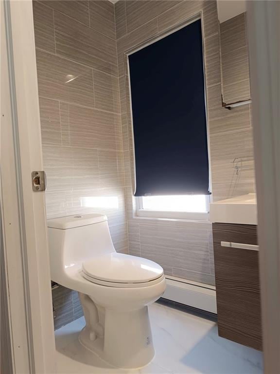268 Nelson Ave, Staten Island, NY 10308 - half bath featuring tile walls, vanity, and a baseboard heating unit