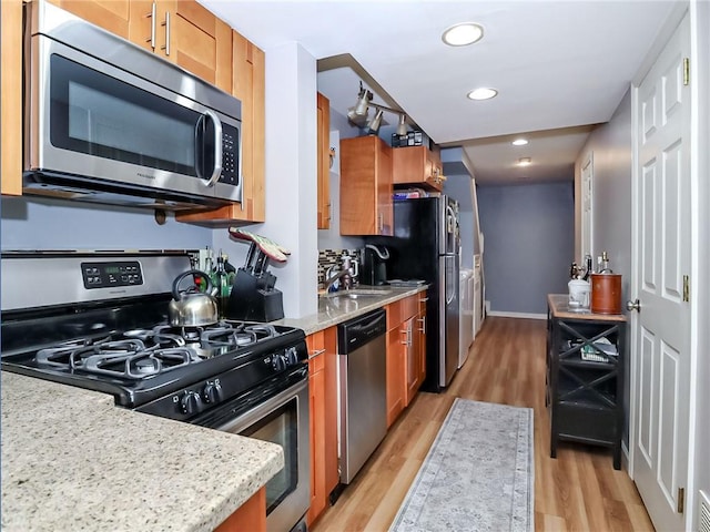 21 Stroud Ave, Staten Island, NY 10312 - kitchen with appliances with stainless steel finishes, light wood-style flooring, recessed lighting, and brown cabinetry