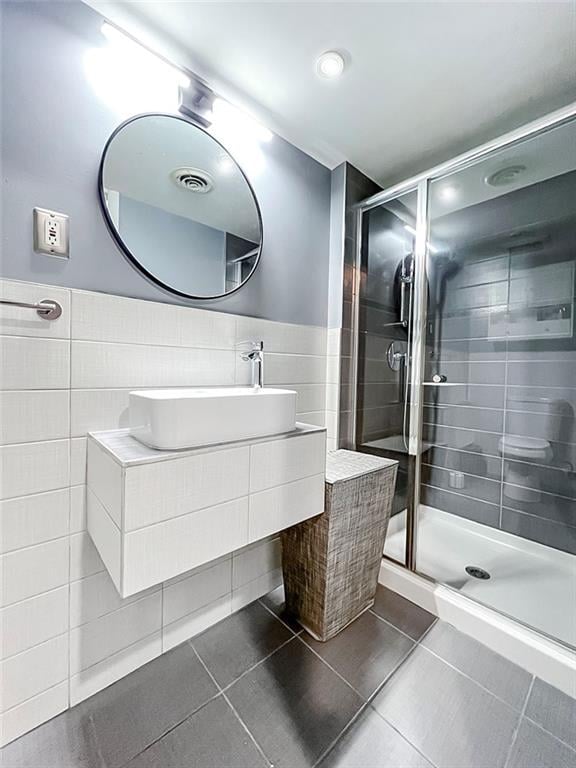 21 Stroud Ave, Staten Island, NY 10312 - full bath with tile walls, tile patterned floors, a shower stall, and vanity