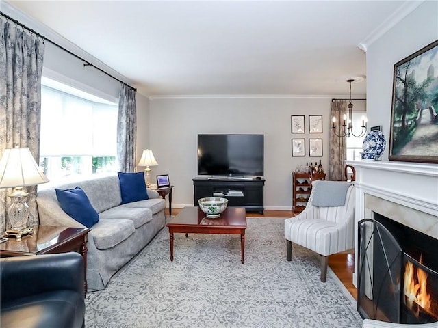 21 Stroud Ave, Staten Island, NY 10312 - living room featuring a chandelier, ornamental molding, wood finished floors, and a warm lit fireplace