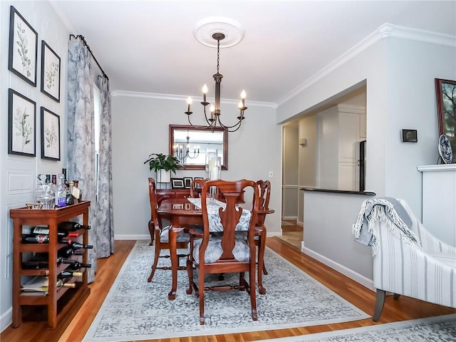 21 Stroud Ave, Staten Island, NY 10312 - dining space with a chandelier, wood finished floors, and ornamental molding