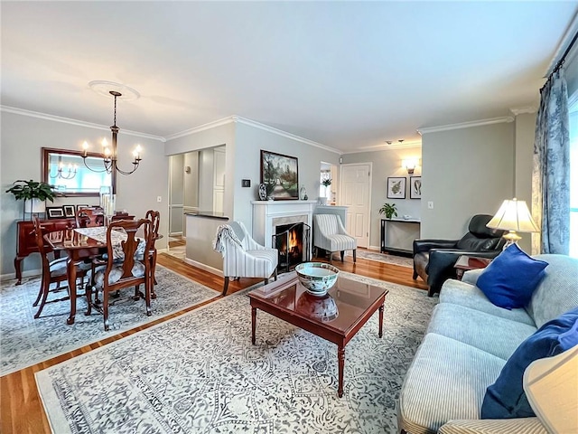 21 Stroud Ave, Staten Island, NY 10312 - living room with wood finished floors, a chandelier, crown molding, and a lit fireplace