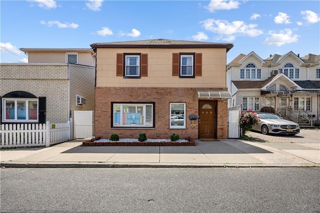 324 Norway Ave, Staten Island, NY 10305 - townhome / multi-family property featuring brick siding and a gate