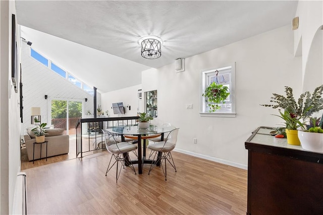 324 Norway Ave, Staten Island, NY 10305 - dining room featuring wood finished floors and lofted ceiling