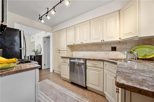 324 Norway Ave, Staten Island, NY 10305 - kitchen with stainless steel dishwasher, freestanding refrigerator, cream cabinets, and light tile patterned floors