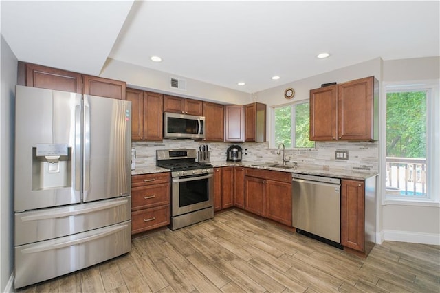 37 Quail Ln, Staten Island, NY 10309 - kitchen featuring stainless steel appliances, light wood finished floors, backsplash, light stone counters, and recessed lighting
