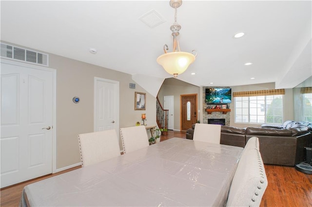 37 Quail Ln, Staten Island, NY 10309 - dining area featuring wood finished floors, stairway, a fireplace, and recessed lighting
