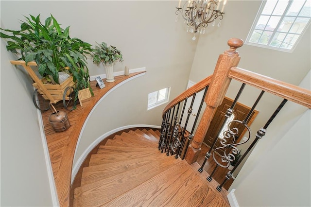 37 Quail Ln, Staten Island, NY 10309 - stairway with a chandelier and baseboards