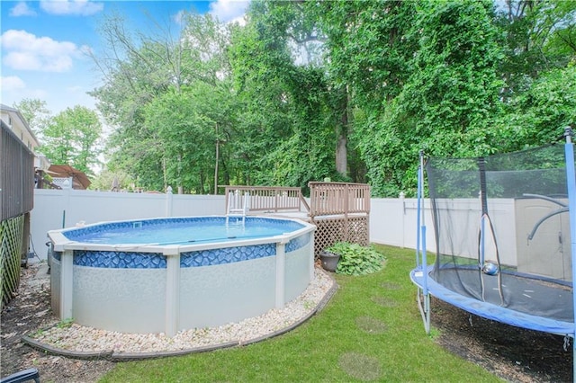 37 Quail Ln, Staten Island, NY 10309 - view of pool with a trampoline, a fenced backyard, and a deck