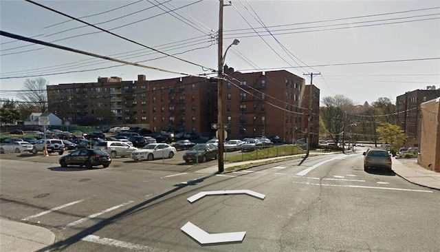 555 Bronx River Rd Unit 5E, Yonkers, NY 10704 - view of asphalt street with street lights, sidewalks, and curbs