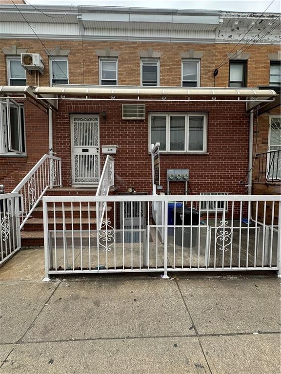 1762 64th St, Brooklyn, NY 11204 - rear view of house with brick siding and a fenced front yard