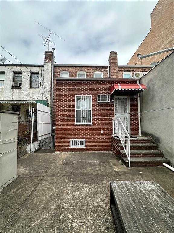 1762 64th St, Brooklyn, NY 11204 - back of property with brick siding and cooling unit