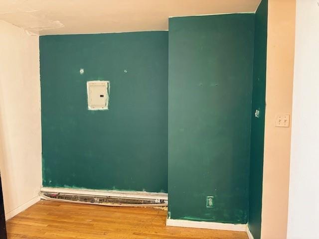 894 New Lots Ave, Brooklyn, NY 11208 - laundry area with wood finished floors and baseboards