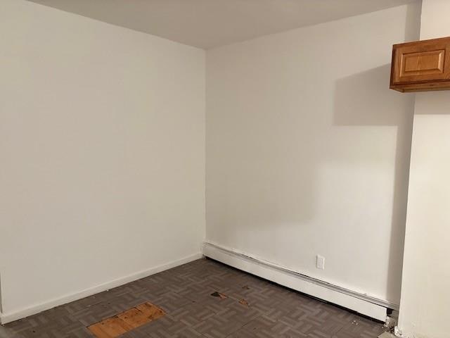 894 New Lots Ave, Brooklyn, NY 11208 - empty room featuring baseboard heating