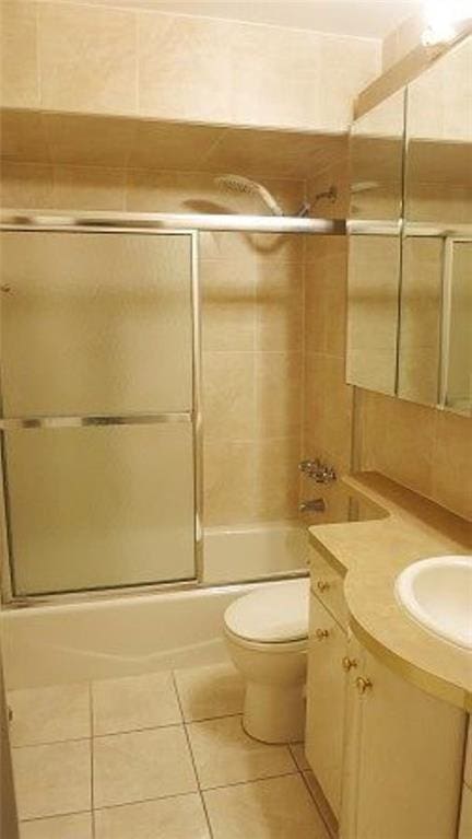 1247 E 69th St, Brooklyn, NY 11234 - bathroom featuring enclosed tub / shower combo, vanity, and tile patterned flooring